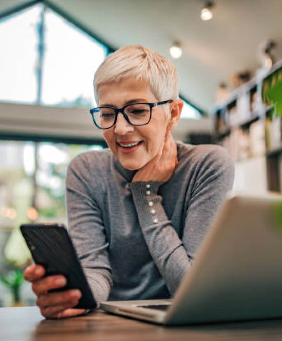 woman-phone-smiling-1 A woman talking with a doctor through FaceTime.
