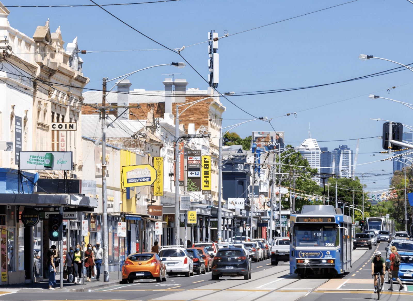 Sydney Road, Brunswick with heritage shopfronts and a tram